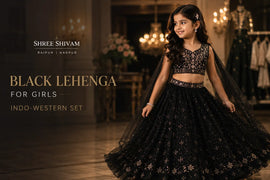 Young girl wearing a black Indo-Western lehenga with elegant embroidery, posing in a luxurious wedding venue for festive party wear styling inspiration.