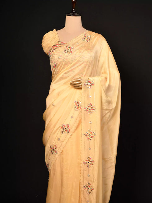 Cream saree with patch work & Moti Border