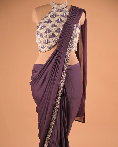 Plum Pleated Designer Saree with Halter Neck Embellished Blouse