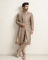 A man wearing an elegant Chikoo Sherwani, perfect for weddings and festive occasions.