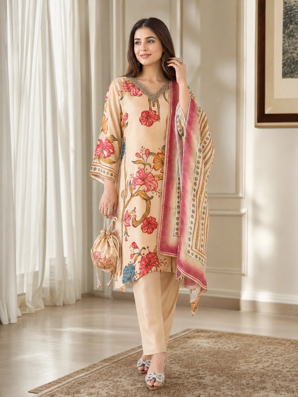 Woman wearing a brown floral print kurta set with a dupatta, embellished neckline, and matching pants.