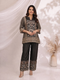 Woman wearing a black printed kurta with wide-leg pants, featuring floral motifs and a contrasting border.