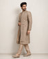 A man wearing an elegant Chikoo Sherwani, perfect for weddings and festive occasions.