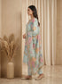Woman wearing a sky blue kurta set with floral dupatta, featuring intricate neckline embroidery and a shimmering border.