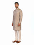 Man wearing a multi-color textured kurta with shimmering accents and cream pants, ready for festive occasions.