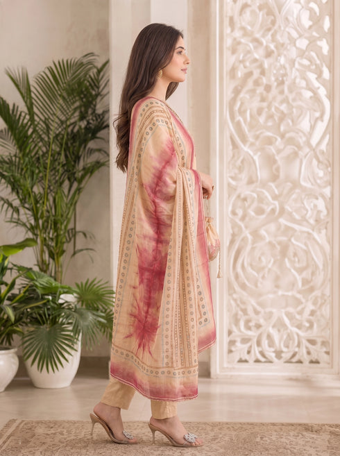 Woman wearing a brown floral print kurta set with a dupatta, embellished neckline, and matching pants.