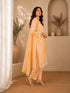 Woman wearing a yellow floral embroidered Kurti Set with lace trim and matching dupatta.