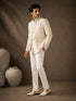 Man wearing a classic white Jodhpuri suit, perfect for formal Indian events and celebrations.