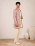 Model wearing an elegant purple Indowestern gown with delicate embroidery, front view.