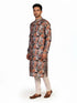 Man wearing a multi-color floral print kurta with an embellished neckline and cream churidar pants.