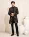 Man wearing a stylish black Indo-Western suit, showcasing modern Indian ethnic wear.
