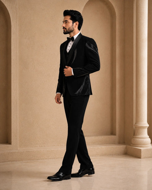 A classic black taxido suit for men, showcasing a sharp silhouette and elegant formal wear.