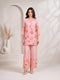 Woman wearing a pink floral print kurta with matching palazzo pants and lace trim.