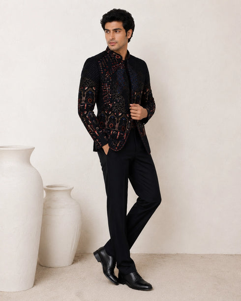 Man wearing an elegant navy blue Jodhpuri suit, a traditional Indian formal outfit.