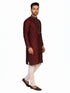 Man wearing a maroon kurta with a diamond pattern and embroidered neckline, paired with cream pants.