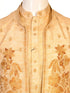 Man wearing a beige embroidered kurta jacket set with golden floral patterns, suitable for festive occasions.