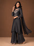 Woman wearing a Fawn sparkling embroidered Sharara with intricate floral details on the neckline and cuffs.