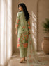 A woman models a green floral embroidered Kurti Set with matching pants and a dupatta, featuring delicate lace trim.