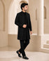 Man wearing a stylish black Indo-Western suit, perfect for formal events and celebrations.