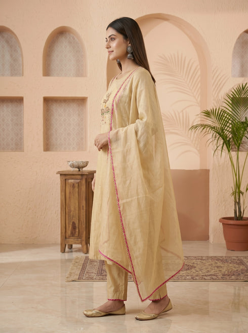 Elegant cream embroidered kurta set with pink trim dupatta and matching pants, perfect for festive occasions.