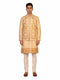 Man wearing a beige embroidered kurta jacket set with golden floral patterns, suitable for festive occasions.