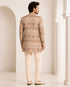 Man wearing an elegant beige Sherwani, showcasing intricate embroidery and a classic fit for formal events.