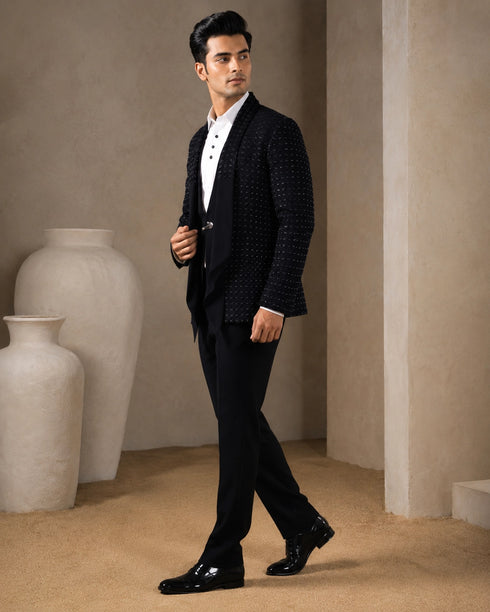 A classic navy taxido suit, perfect for formal events and special occasions.
