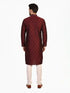 Man wearing a maroon kurta with a diamond pattern and embroidered neckline, paired with cream pants.