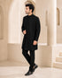 Man wearing a stylish black Indo-Western suit, perfect for formal events and celebrations.