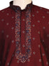 Man wearing a maroon kurta with a diamond pattern and embroidered neckline, paired with cream pants.