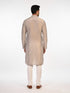 Man wearing a multi-color textured kurta with shimmering accents and cream pants, ready for festive occasions.