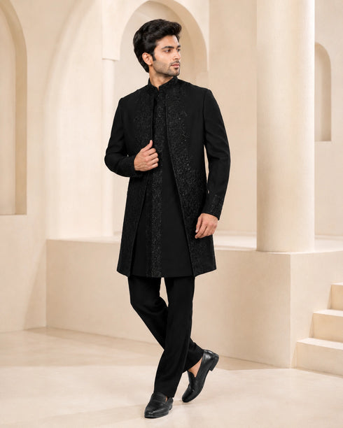 Man wearing a stylish black Indo-Western suit, perfect for formal events and celebrations.