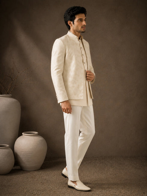 Man wearing a classic white Jodhpuri suit, perfect for formal Indian events and celebrations.