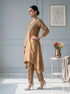Woman in a golden embroidered kurta set with matching pants and a patterned dupatta, featuring a V-neckline and tassel details.