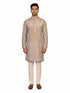 Man wearing a multi-color textured kurta with shimmering accents and cream pants, ready for festive occasions.
