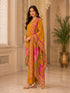 Woman wearing a mustard yellow kurta set with floral prints and palazzo pants, draped with a printed dupatta.