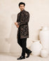 Man wearing a stylish black Indo-Western suit, showcasing modern Indian ethnic wear.