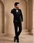 A classic black taxido suit for men, showcasing a sharp silhouette and elegant formal wear.