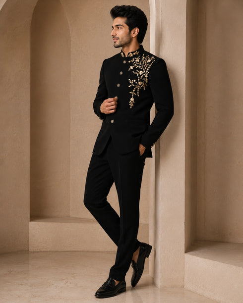 Man wearing a classic black Jodhpuri suit, a traditional Indian formal outfit.