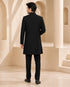 Man wearing a stylish black Indo-Western suit, perfect for formal events and celebrations.