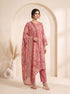 Woman wearing a rose pink printed kurti set with a dupatta, featuring leaf motifs and striped patterns.