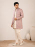 Model wearing an elegant purple Indowestern gown with delicate embroidery, front view.