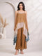 Woman wearing a brown layered chiffon palazzo suit with a sequined neckline and flowing sleeves.