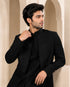 Man wearing a stylish black Indo-Western suit, perfect for formal events and celebrations.