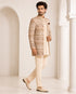 Man wearing an elegant beige Sherwani, showcasing intricate embroidery and a classic fit for formal events.