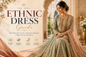 Elegant Indian woman wearing a modern embroidered ethnic dress with festive drape styling in a luxury heritage setting.