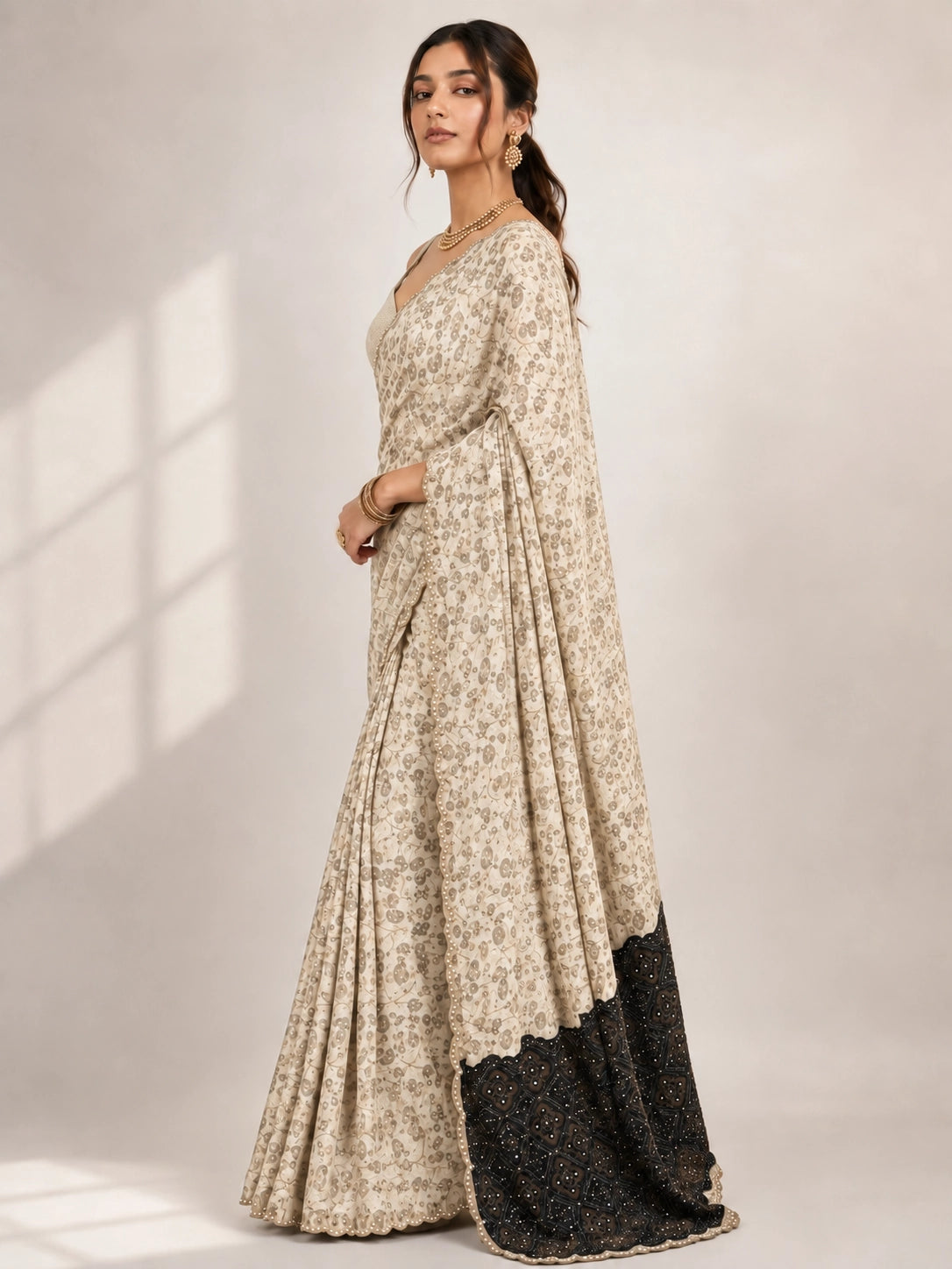 Elegant Cream  Printed Saree with Gold Blouse and Embellished Pallu