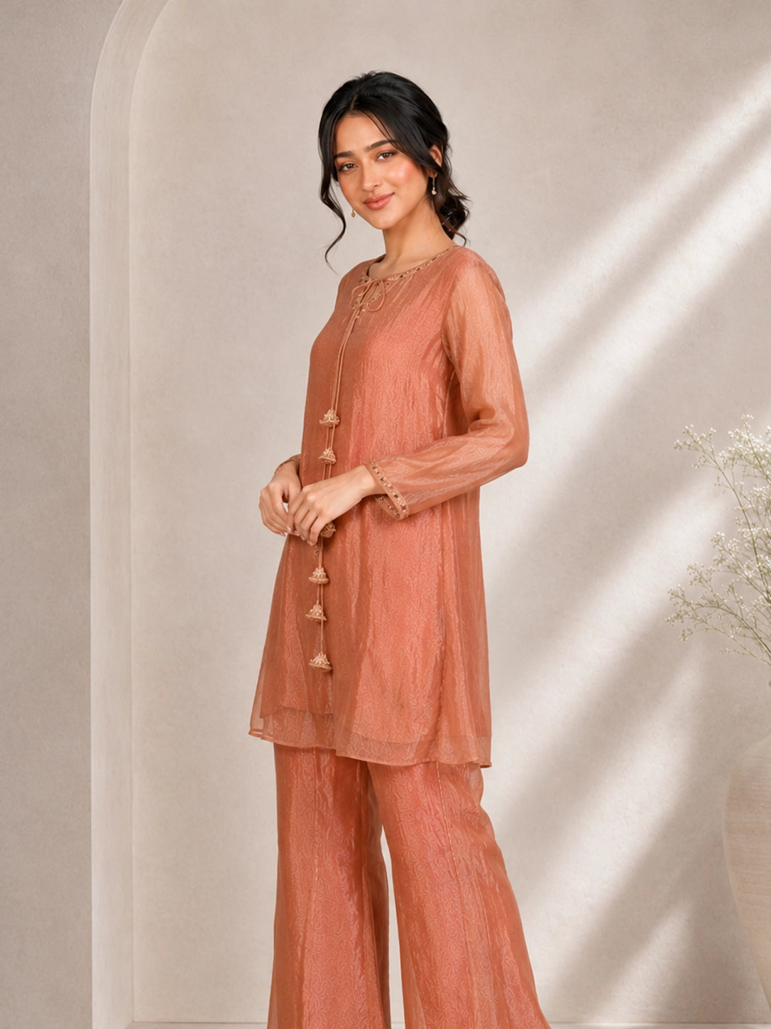 Elegant Peach Embroidered Kurta with Tassel Detail