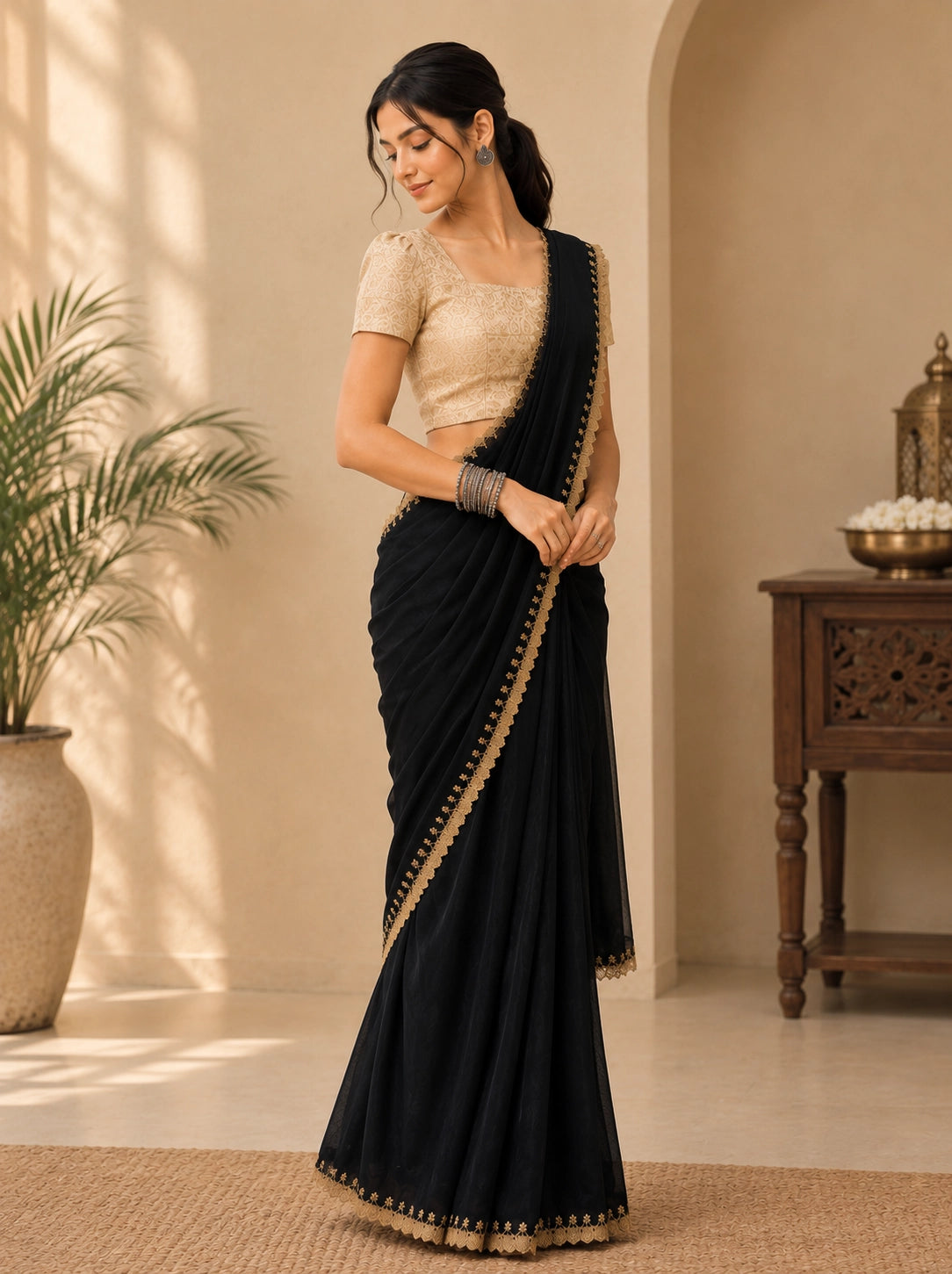 Elegant Black Saree with Gold Embroidered Border and Blouse