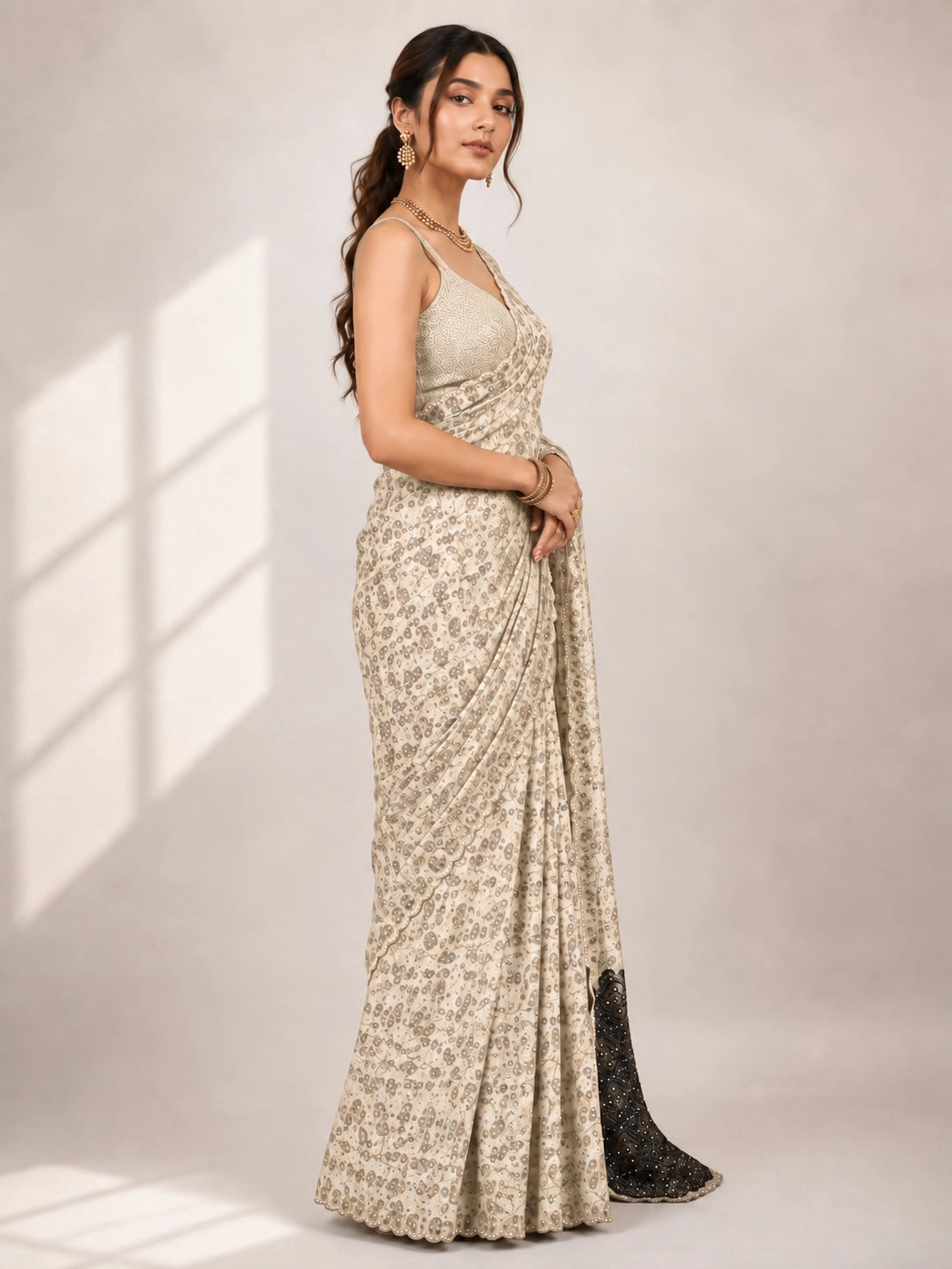 Elegant Cream  Printed Saree with Gold Blouse and Embellished Pallu